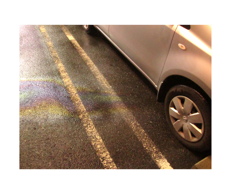 Oil spot on ground, a telltale sign of a car oil leak.